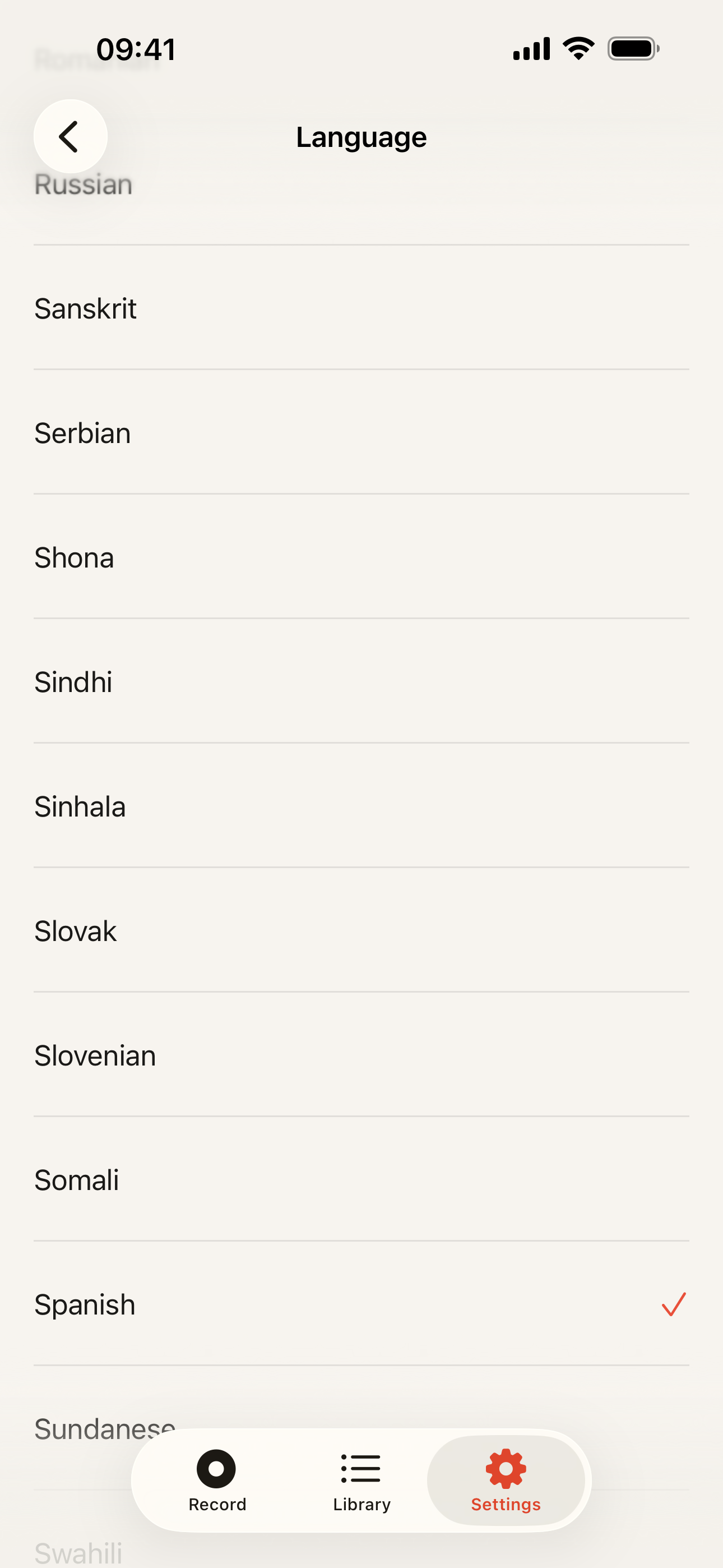 Language setting: Long, scrollable language list; Spanish ticked as the chosen language.